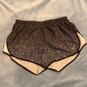 Black and white Nike running shorts